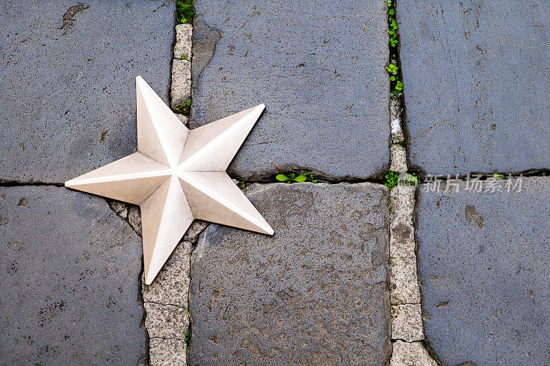 One of the stars in the pavement of Piazza di Montecitorio in front of the Italian Parliament